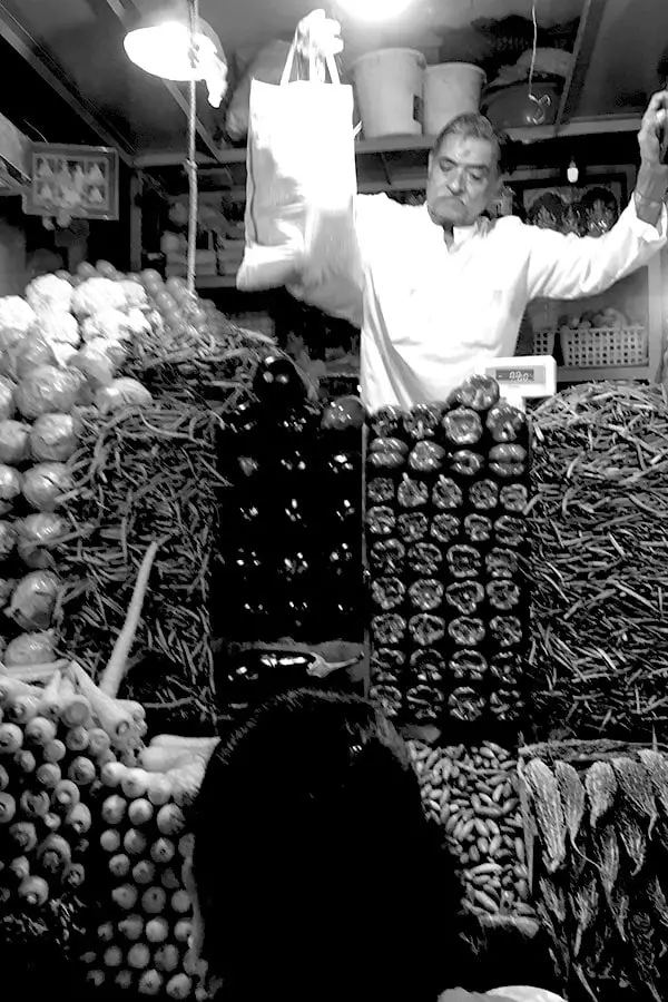 Indian vegetable seller selling vegetables in the market