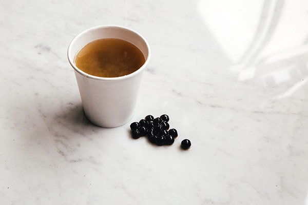 Black Tapioca Pearls along with a glass of tea