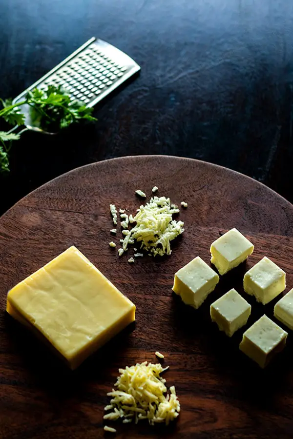 Cheese and Paneer on a wooden board