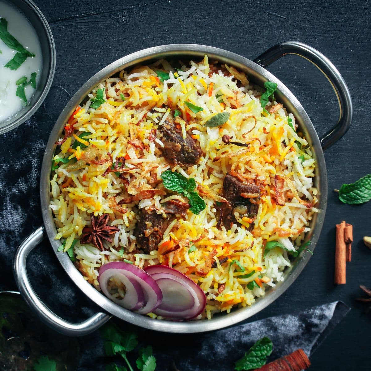 biryani in a serving kadai featured image