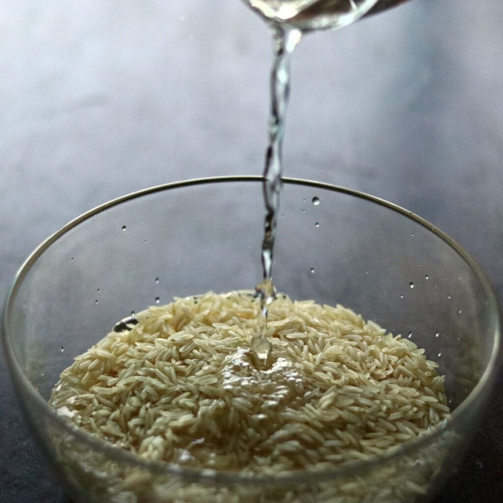 adding water to basmati rice